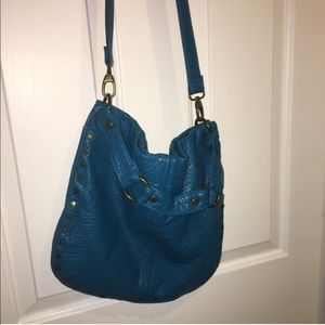 Teal colored vegan leather bag
